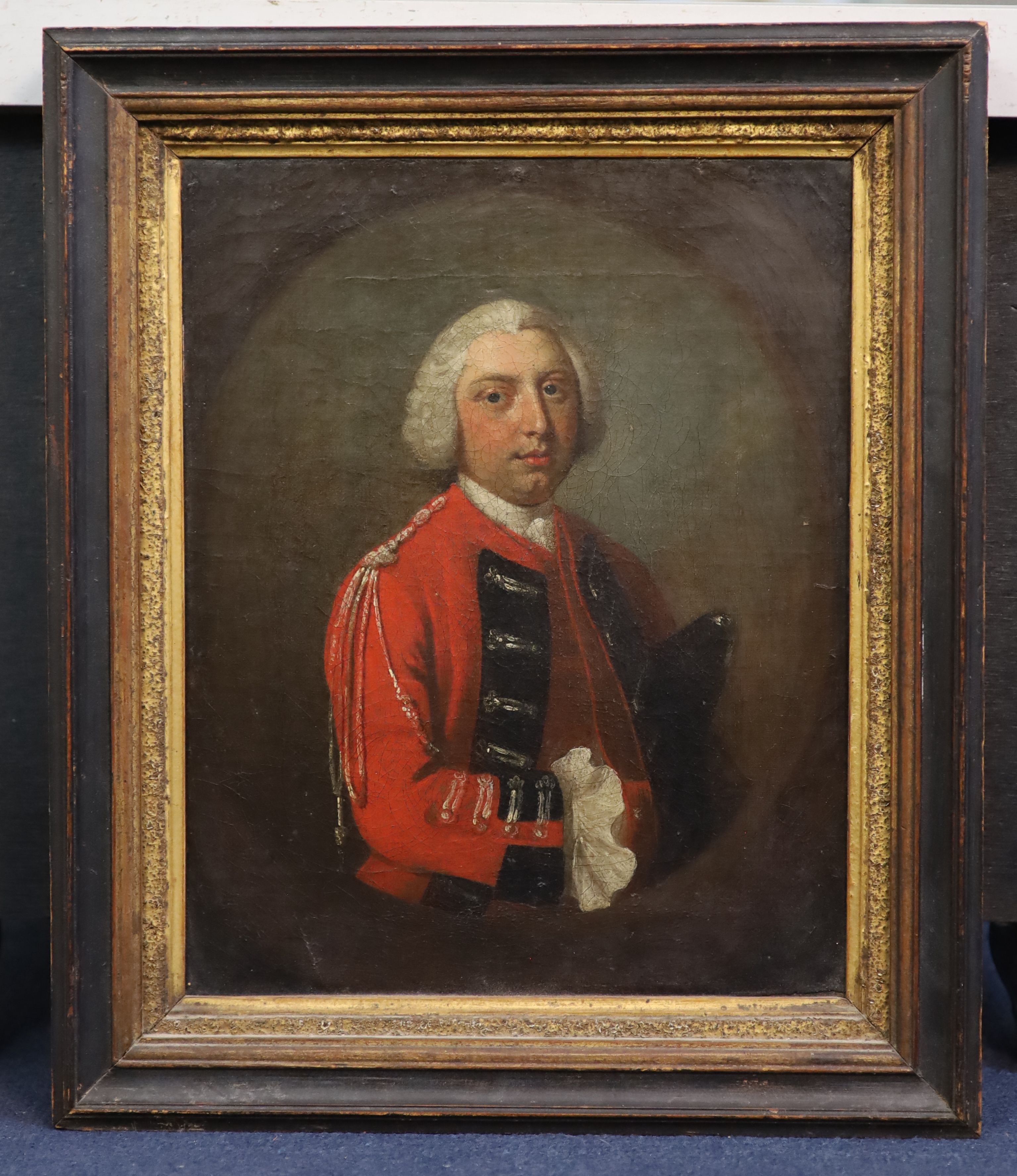 Mid 18th century English School , Portrait of an army officer wearing a scarlet coat, oil on canvas, 30.5 x 24cm